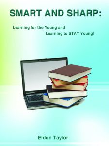 Image of books sitting on a computer representing learning to stay smart and sharp and young.