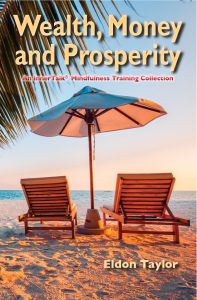 Two chair on a tropical beach under an umbrella - depicting wealth, money, and prosperity.