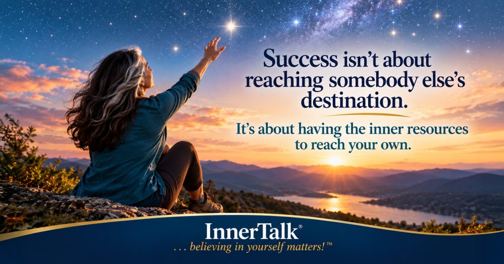 Woman with silver-streaked hair reaching toward the stars above a mountain landscape, representing the inner resources we draw upon to reach our own definition of success.